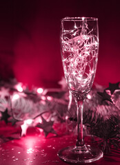  glass of champagne wiyth a christmas lights