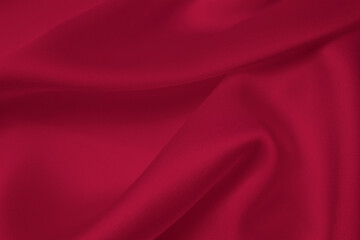 Naklejka na ściany i meble Red silk satin background. Monochrome color background. Trendy color 2023.