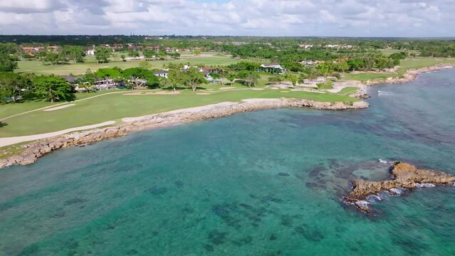 Seaside Golf Course With Crystal-clear Blue Water Of Caleton de la Majagua Bay In Casa de Campo, Dominican Republic. - aerial