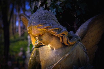 Ancient statue of beautiful guardian angel. Horizontal image.