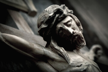 Close up an ancient wooden statue of holy cross with crucified Jesus Christ.