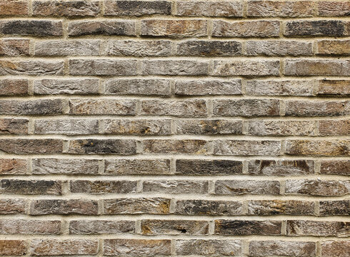 Old vintage masonry brick wall grungy texture background.