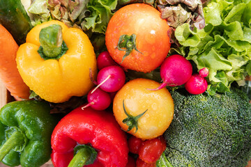 Wooden crate filled with fresh organic vegetables .