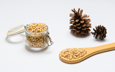 Pine nuts and cones on a light background. The concept of natural food.
