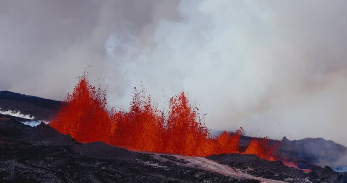 Slow motion of volcano erupting molten hot lava fountain from the Hawaii Mauna Loa volcano eruption of 2022