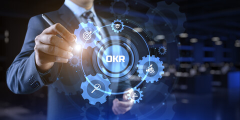 OKR Objectives key results. Businessman pressing button on screen.