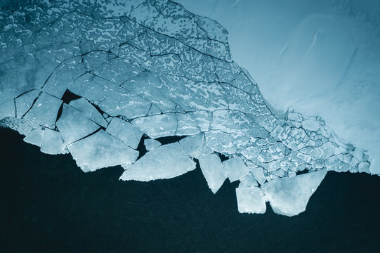 Aerial View Of Cracking Ice on a lake in Lapland 