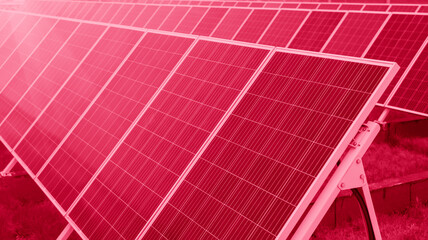 Production of renewable green energy concept. Image toned in color of year 2023 Viva Magenta....