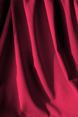 Natural fabric linen texture. Magenta canvas for Background. Vertical crop. Color of the year 2023.