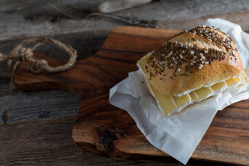 Rustic sandwich with german Bun with cumin and salt topped with low fat and high protein quark...