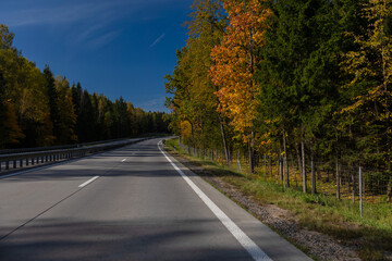 Highway wide road, transport and blue sky with clouds on a summer day