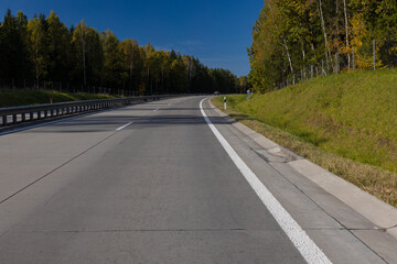 Highway wide road, transport and blue sky with clouds on a summer day
