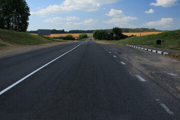 Highway wide road, transport and blue sky with clouds on a summer day