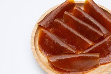 Dried mango paste sheets on white background.