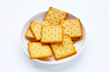 Dry cracker cookies on white background.