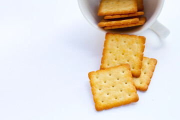 Dry cracker cookies on white background.