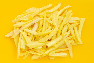 Preserved bamboo shoot on yellow background.