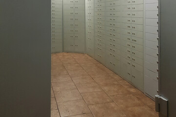 Storage with individual deposit grey cells boxes in the bank and brown floor