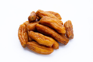 Sun-dried bananas on white background.