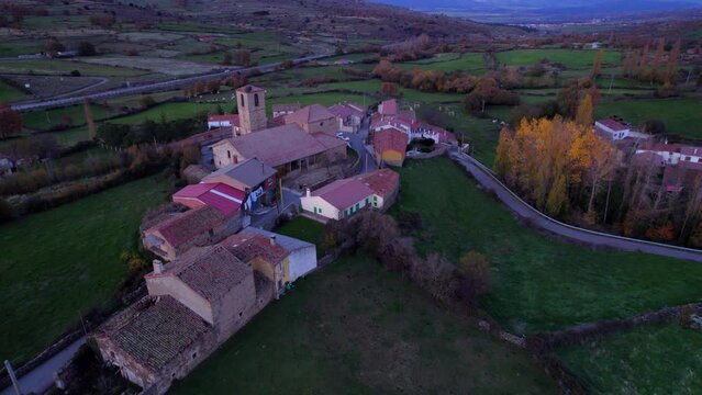 Aerial view of the small Santiago del Collado village in Avila at sunset time, Spain.