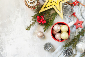 Merry Christmas and Happy Holidays greeting card New Year. Christmas mug with Christmas decorations and pine branches. View from above. Copy space.