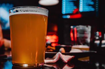 glass of light beer in a bar or pub