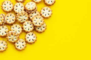 Pineapple biscuits on yellow background.
