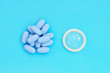 Condom with PrEP ( Pre-Exposure Prophylaxis) blue pills used to prevent HIV