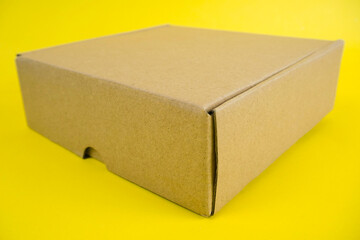 cardboard boxes of various shapes and positions isolated on a yellow background       