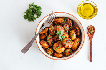 Healthy Sauteed Mushrooms in a Bowl with Olive Oil and Cilantro Top Down Photo