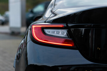 Detailed view of rear end of modern sport car  - obrazy, fototapety, plakaty