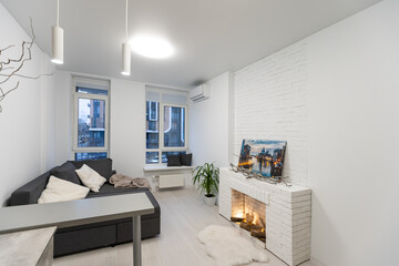 Bright living room interior with fireplace