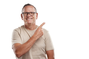 Shot of a handsome mature man standing alone against a grey background in the studio and pointing...