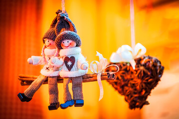 Fototapeta premium Salzburg, Austria - Winter traditional dolls ornaments for Christmas Tree, Christkindlmarkt