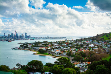 Looking over historical suburb of Devonport on the shore of Auckland Harbour. Distant skyline of Auckland CBD on the horizon. North Island, New Zealand