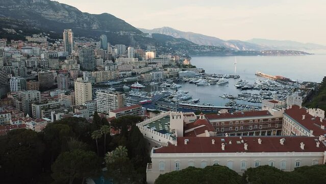 Flying Above The Prince's Palace Of Monaco Overlooking Port And The Mediterranean Sea. aerial tilt-up