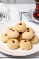 Pistachio cookies. Cookies with flour on wood background. close up