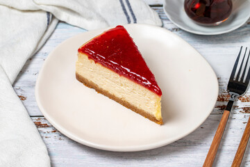 Cheesecake. New York cake. Raspberry cheesecake on wood floor background. close up