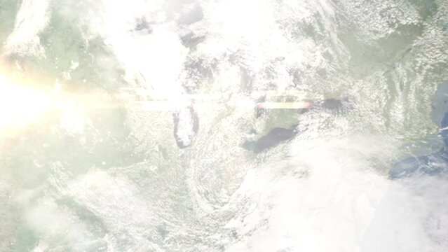 Earth zoom in from outer space to city. Zooming on Lansing, Michigan, USA. The animation continues by zoom out through clouds and atmosphere into space. Images from NASA