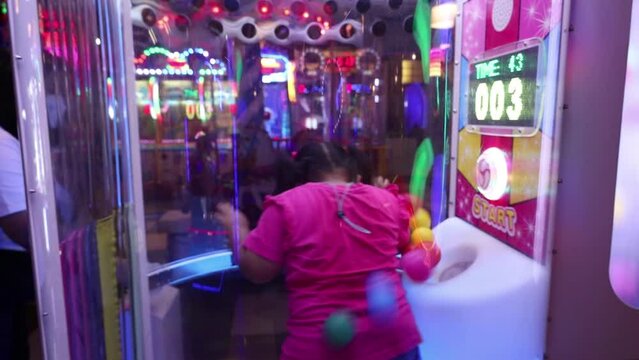 The excitement of children playing in the game area or playground at mall