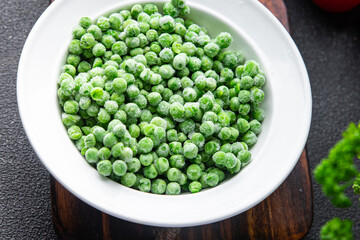 green pea frozen fruit in bowl fresh snack healthy meal food snack on the table copy space food background rustic top view 