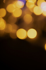 Abstract background of blurred yellow lights for design. Lights bokeh dis focus. Christmas background, copy space