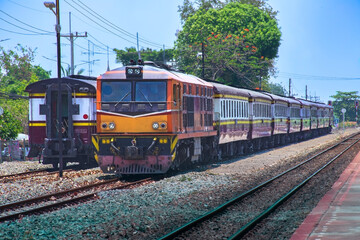 Fototapeta na wymiar Passenger train by diesel locomotive at the railway station. 