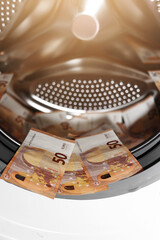 Euro money banknotes in washing machine - illegal cash 50 and mafia money laundering - tax evasion...