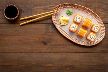 Sushi menu concept. Sushi roll set with salmon on dish