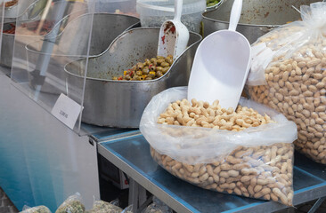 Peanuts and other typical Italian products for sale at a street market
