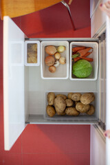 Storing vegetables in the kitchen. Storage organization. View from above.