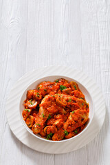 chicken stew with mushrooms in a tomato sauce