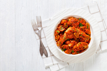 chicken stew with mushrooms in a tomato sauce