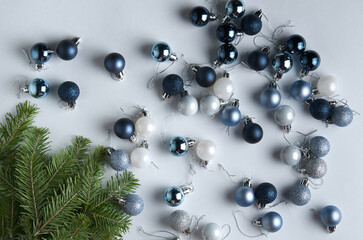 Christmas fletlay from fir twigs and Christmas balls on a white background